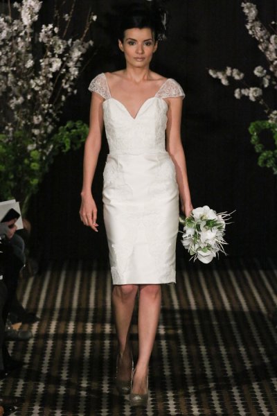 Model walks runway in an Allure wedding dress by Sarah Jassir, for the Sarah Jassir Fall 2011 - Desire bridal collection.