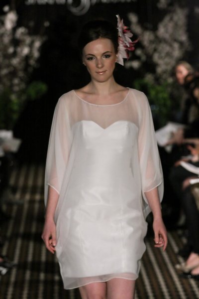 Model walks runway in an Aspire wedding dress by Sarah Jassir, for the Sarah Jassir Fall 2011 - Desire bridal collection.