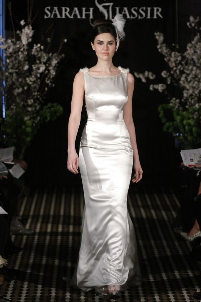 Model walks runway in a Charm wedding dress by Sarah Jassir, for the Sarah Jassir Fall 2011 - Desire bridal collection.