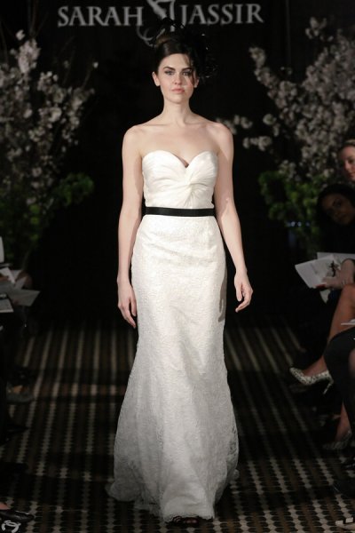 Model walks runway in a Cherish wedding dress by Sarah Jassir, for the Sarah Jassir Fall 2011 - Desire bridal collection.