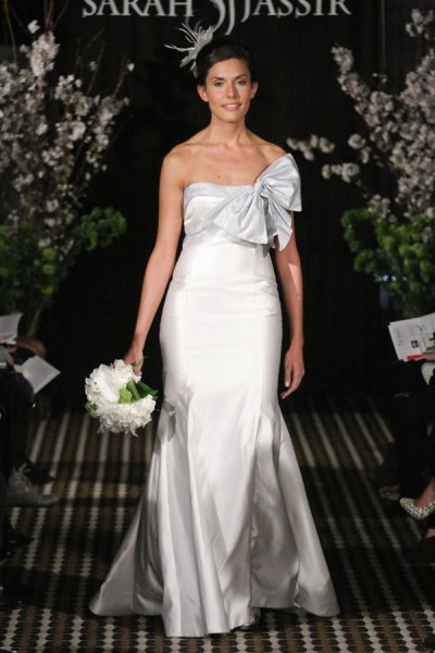 Model walks runway in a Dream wedding dress by Sarah Jassir, for the Sarah Jassir Fall 2011 - Desire bridal collection.