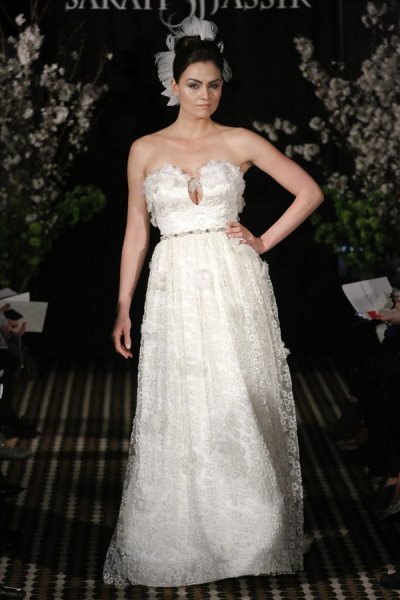 Model walks runway in an Enchanted wedding dress by Sarah Jassir, for the Sarah Jassir Fall 2011 - Desire bridal collection.