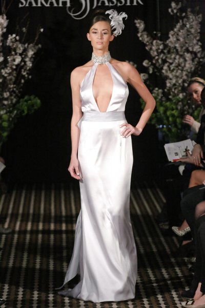 Model walks runway in a Passion wedding dress by Sarah Jassir, for the Sarah Jassir Fall 2011 - Desire bridal collection.