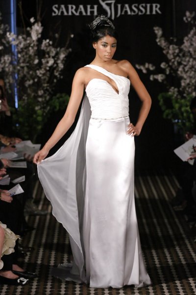 Model walks runway in a Swoon wedding dress by Sarah Jassir, for the Sarah Jassir Fall 2011 - Desire bridal collection.