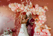 Bride and Groom throwing confetti in Valentine's Inspired shoot.