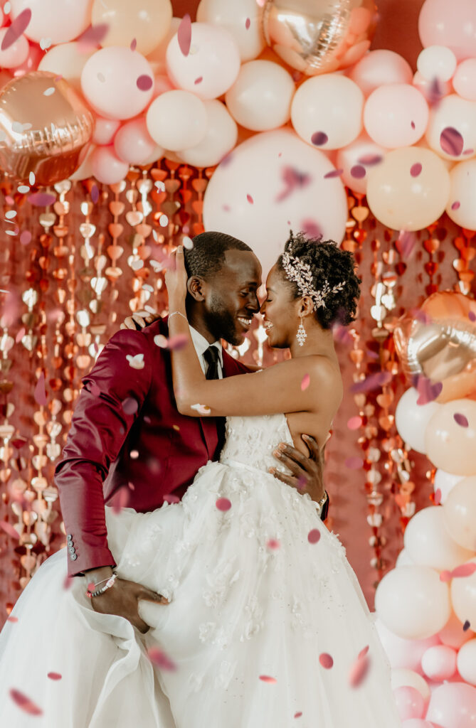 Models dancing in confetti in playful and romantic valentine's shoot.