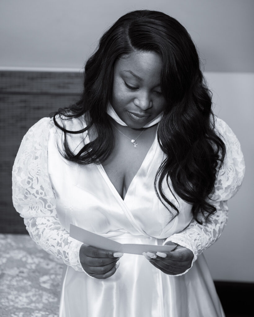 Bride reading letter from her future husband before intimate micro wedding begins.