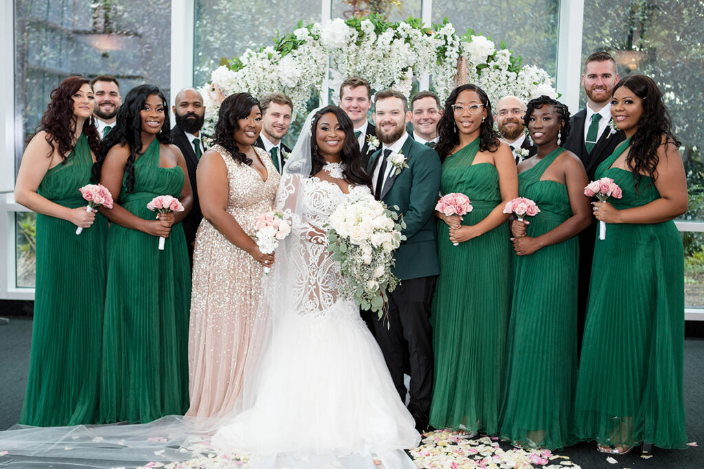 Bridal party pose with bride and groom at intimate micro wedding.