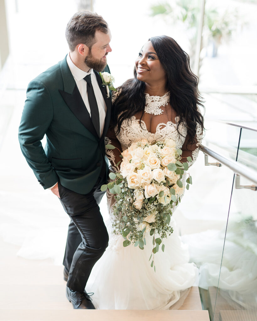 Bride and groom posing for photos in intimate micro wedding.