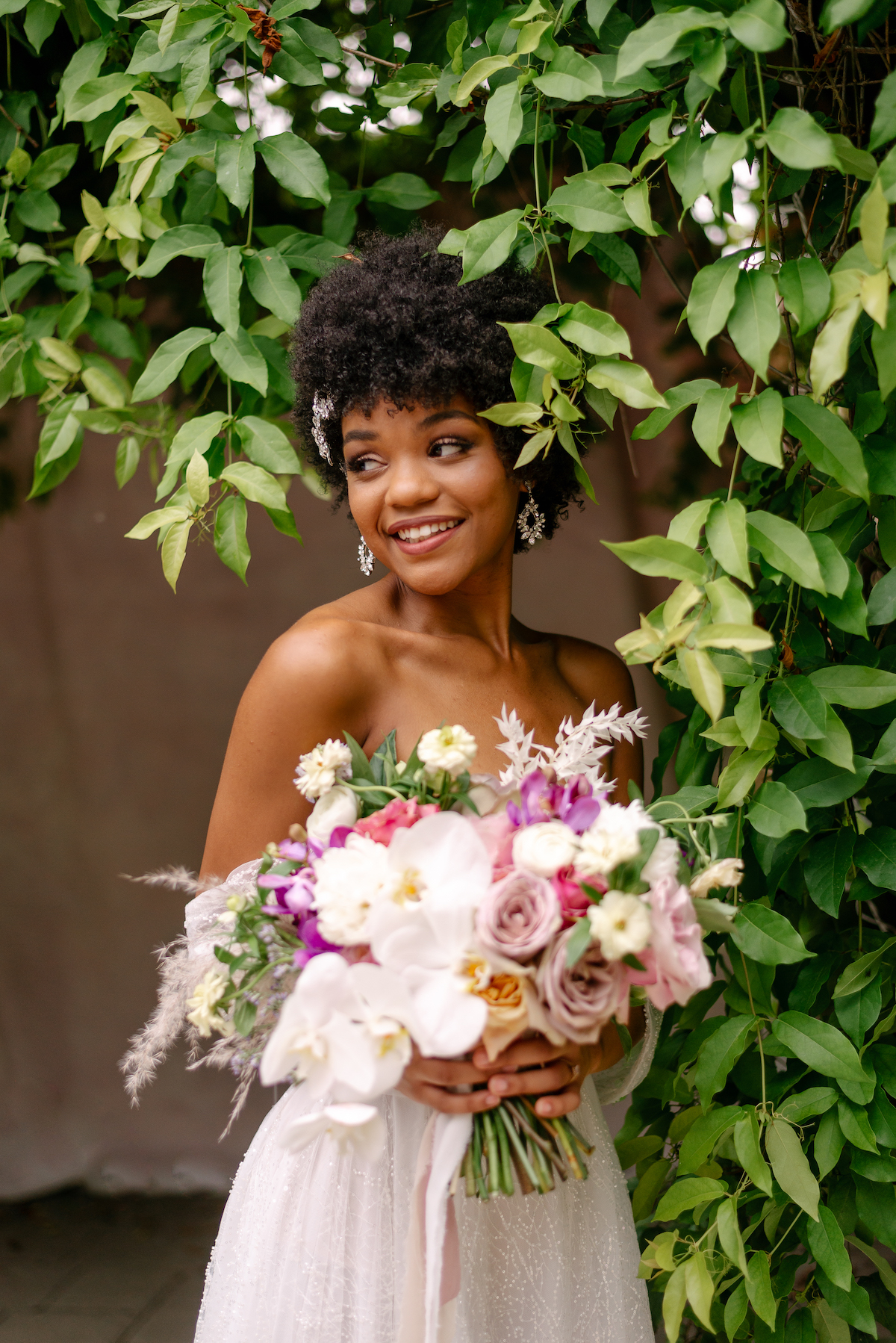 Modern Boho wedding bouquet inspiration and black bride with natural hair.