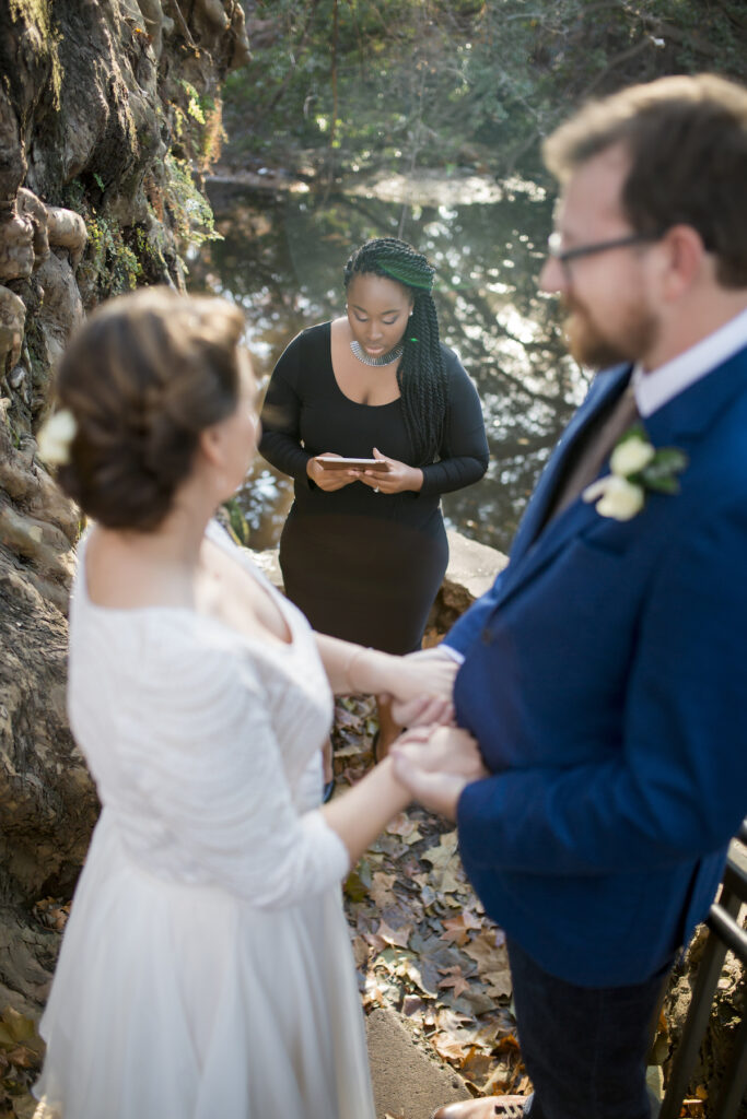 Love Is Blind Officiant Jennifer Allen officiating couple's wedding in a park, photo by SJR & Co