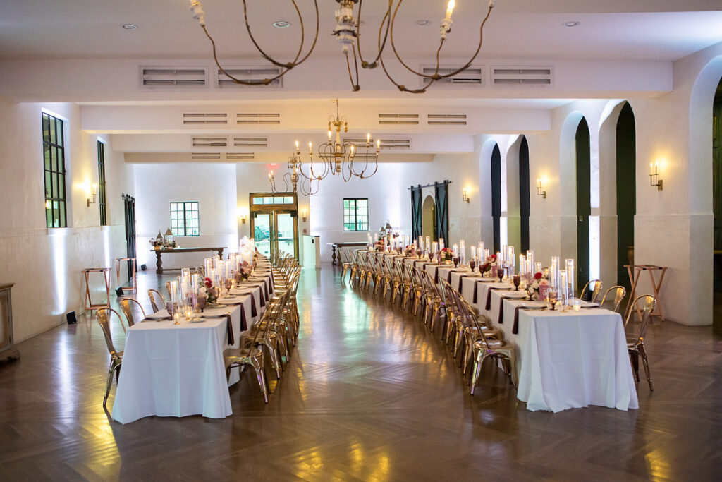 Gabrielle and Kristofer's wedding at the Il Mercato New Orleans was a dream come true with romantic candles, elegant decor, and intricate floral arrangements.