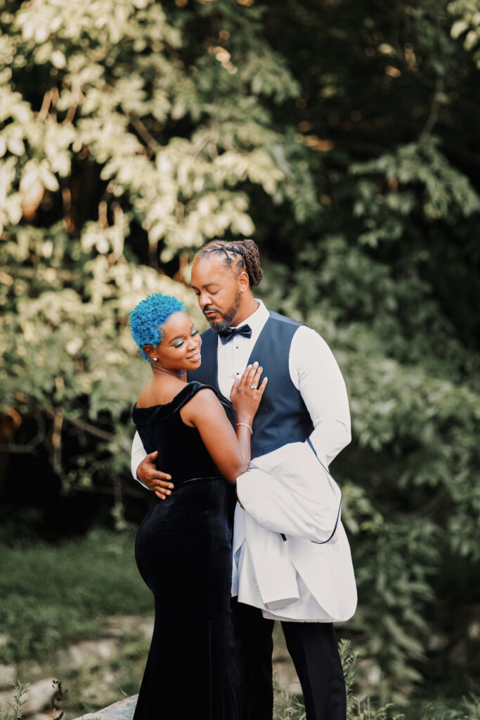 This black excellence-inspired engagement shoot at Great Falls National Park has 3 sexy outfits & blue-dyed natural hair for the bride-to-be.