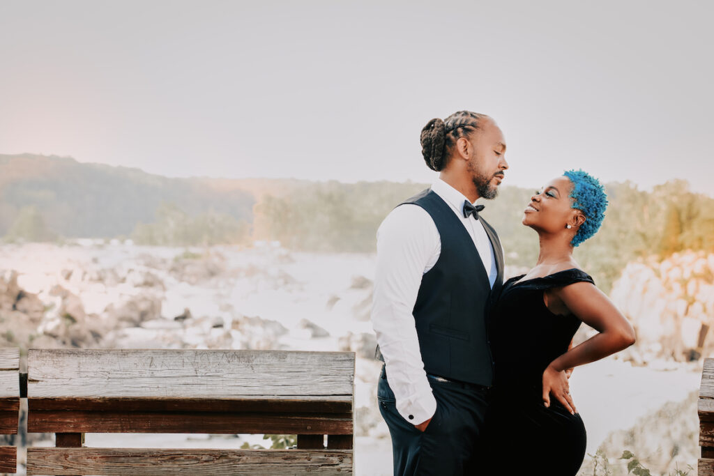 This black excellence-inspired engagement shoot at Great Falls National Park has 3 sexy outfits & blue-dyed natural hair for the bride-to-be.