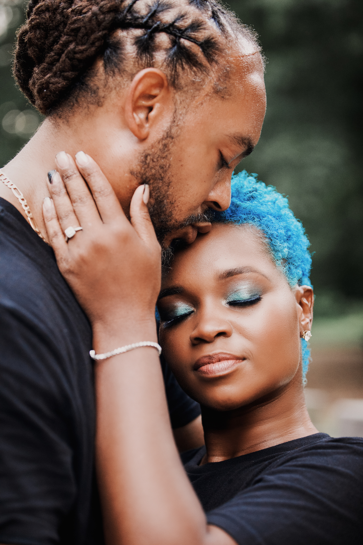 This black excellence-inspired engagement shoot at Great Falls National Park has 3 sexy outfits & blue-dyed natural hair for the bride-to-be.