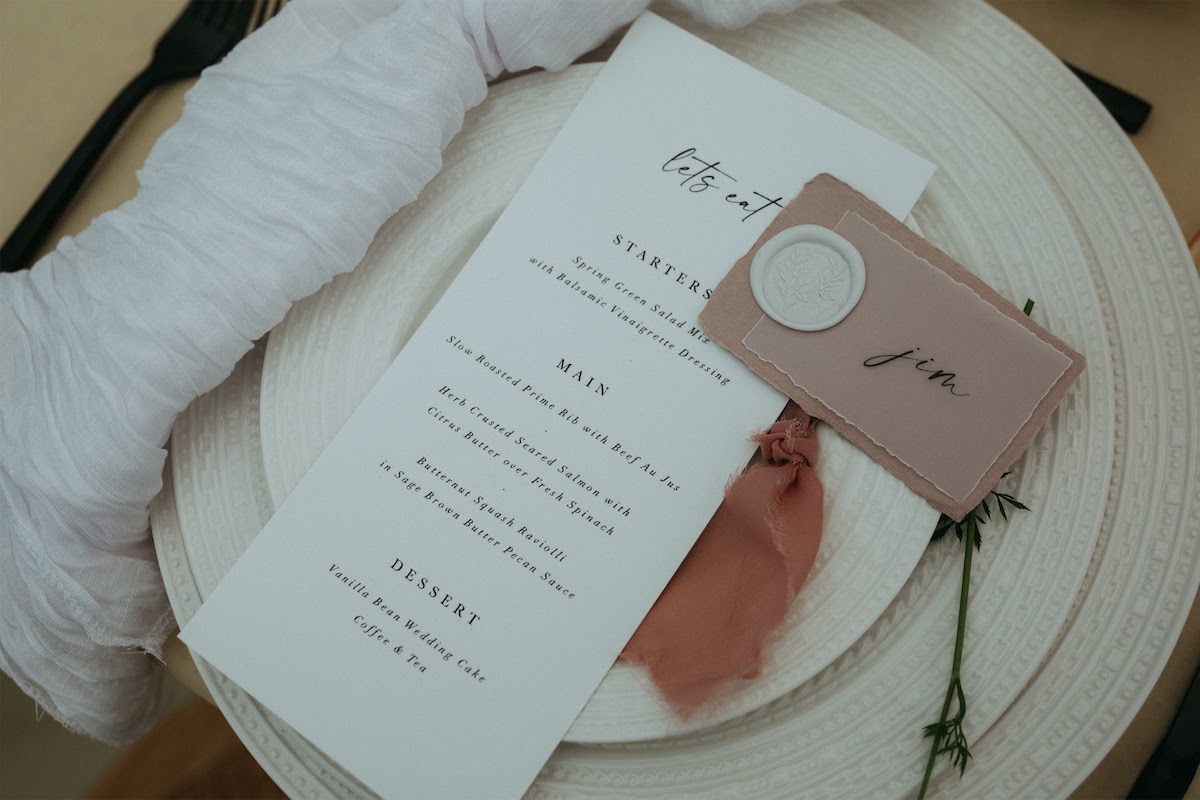 vintage bride at golden hour place setting and stationery