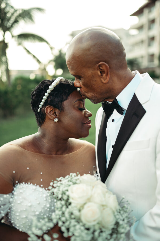 Modern wedding at Royalton Sky Terrace St. Lucia is island luxury at its finest with luscious florals, golden decor, and two luxury gowns.