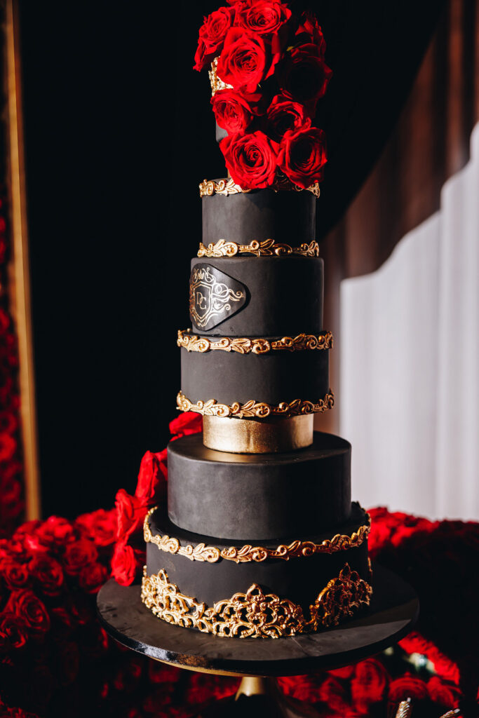 Dayana & Daniel's royal red wedding boasts luscious red florals, adorable flower girls, a dash of Panamá culture, and a decadent black and gold cake.