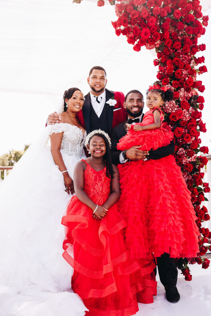 Dayana & Daniel's royal red wedding boasts luscious red florals, adorable flower girls, a dash of Panamá culture, and a decadent black and gold cake.