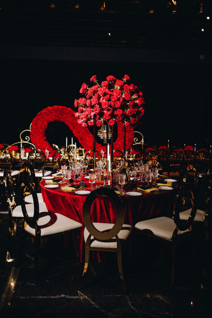 Dayana & Daniel's royal red wedding boasts luscious red florals, adorable flower girls, a dash of Panamá culture, and a decadent black and gold cake.