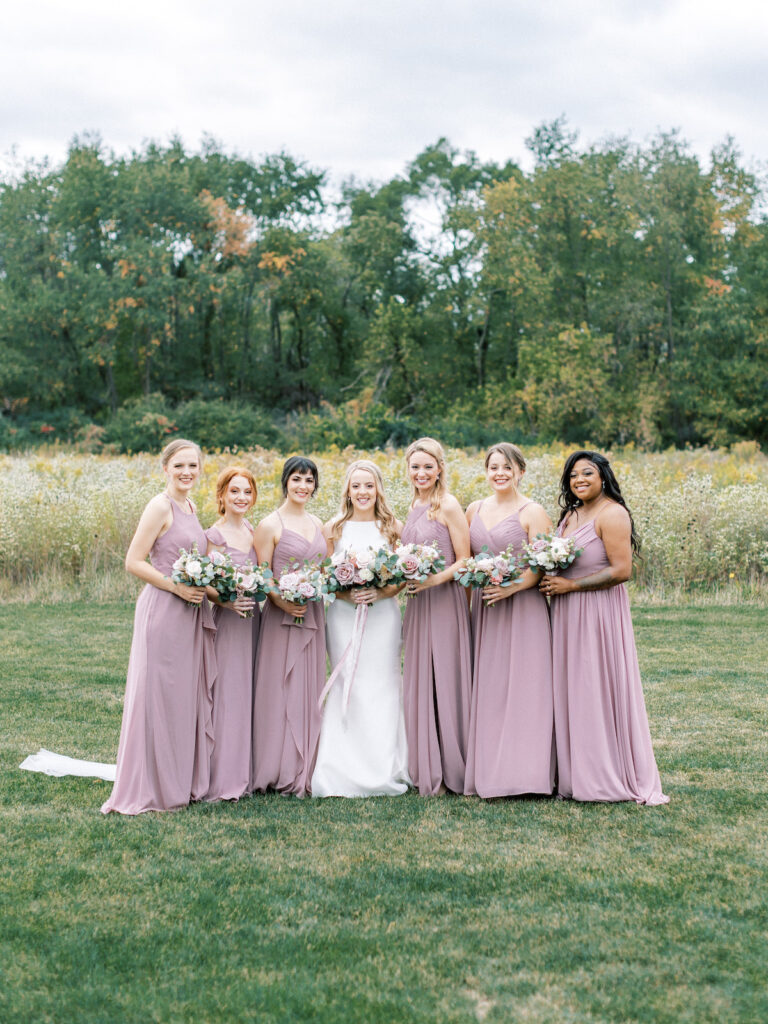 Pastel pink and mauve hues, a sleek modern gown, and a rustic chic venue at Ashton Hill Farm are just a few details from this adorable wedding in Iowa.