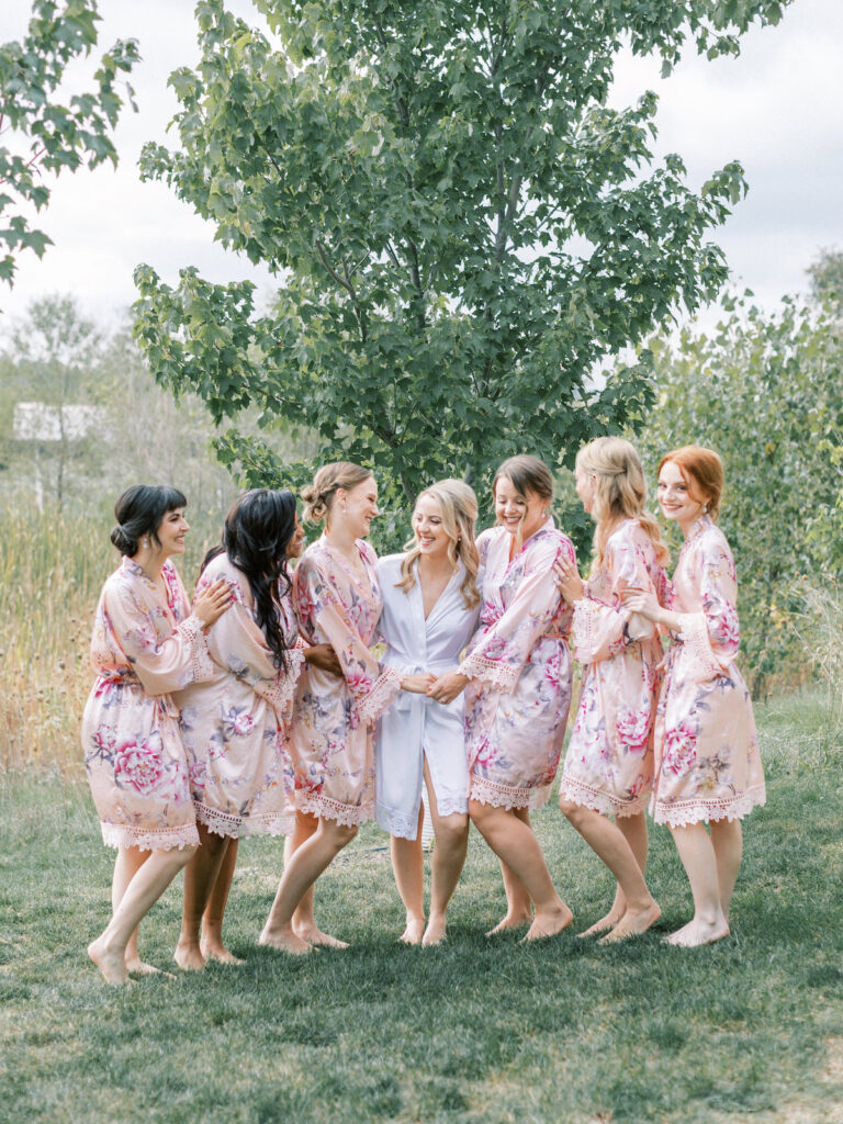 Pastel pink and mauve hues, a sleek modern gown, and a rustic chic venue at Ashton Hill Farm are just a few details from this adorable wedding in Iowa.