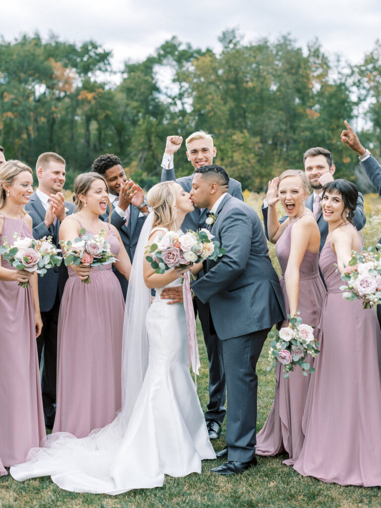 Pastel pink and mauve hues, a sleek modern gown, and a rustic chic venue at Ashton Hill Farm are just a few details from this adorable wedding in Iowa.