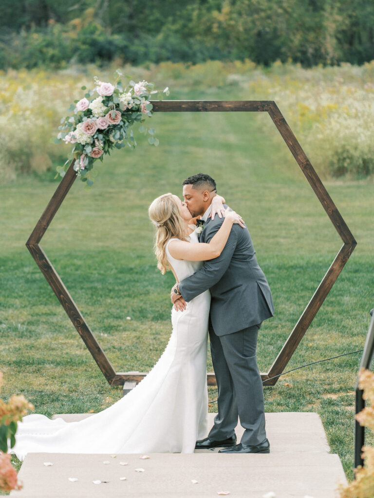 Pastel pink and mauve hues, a sleek modern gown, and a rustic chic venue at Ashton Hill Farm are just a few details from this adorable wedding in Iowa.