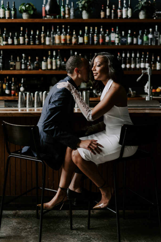 Classy engagement session in uptown Charlotte, North Carolina, takes us on a steamy walkabout from Idlewild Bar to City Hall.