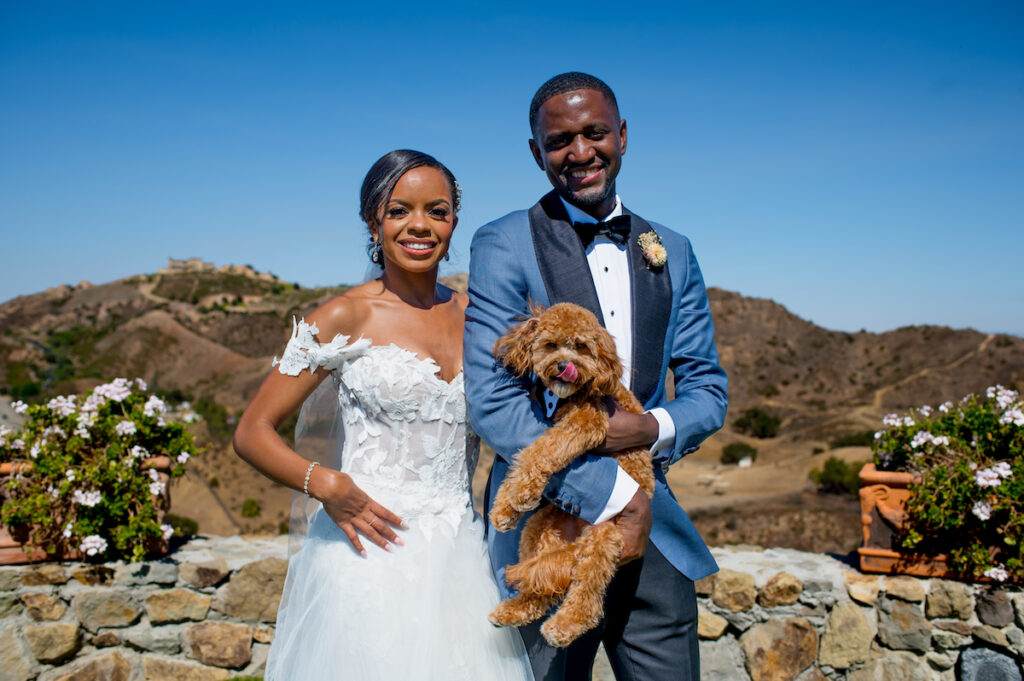 This hilltop vineyard wedding in Malibu is everything sweet with a sunset-inspired color story, an outdoor ceremony, and two glam dresses!