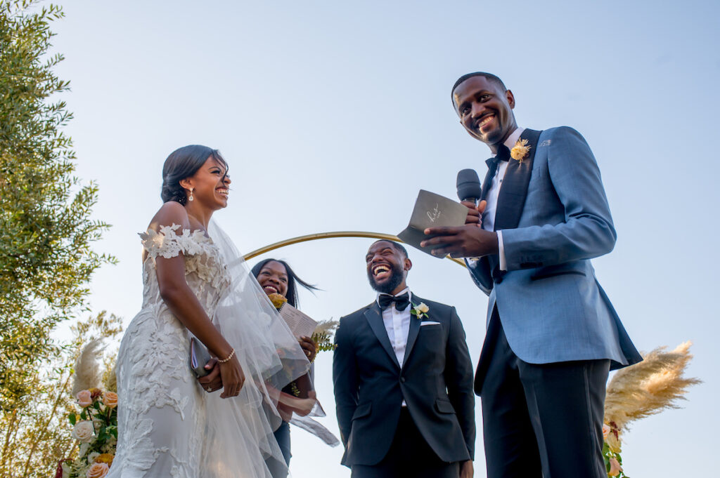 This hilltop vineyard wedding in Malibu is everything sweet with a sunset-inspired color story, an outdoor ceremony, and two glam dresses!