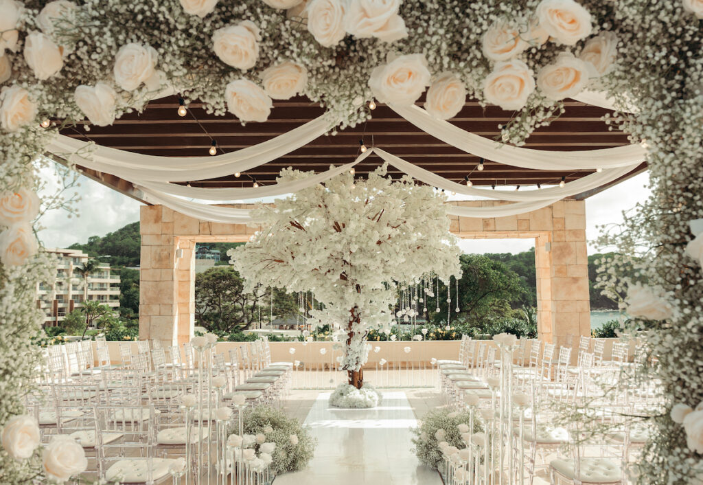 Modern wedding at Royalton Sky Terrace St. Lucia is island luxury at its finest with luscious florals, golden decor, and two luxury gowns.
