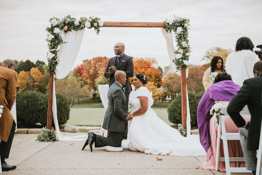 Mixing vintage and modern design, Christian and Leevy’s elegant autumn wedding features a cream and gold color palette and dramatic details.