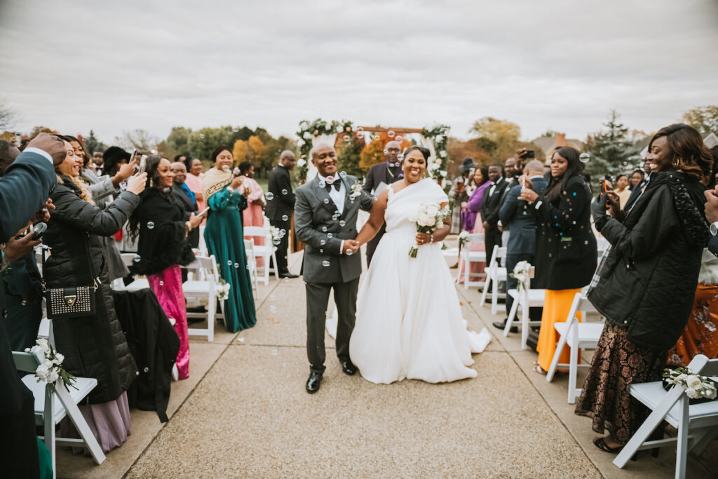 Mixing vintage and modern design, Christian and Leevy’s elegant autumn wedding features a cream and gold color palette and dramatic details.