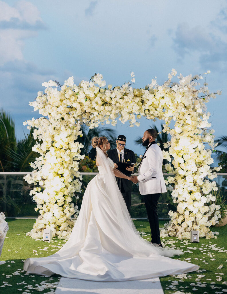Featured in Issue 28, Bree and Ahmad's gorgeous outdoor Miami wedding featured classic ceremony details and stunning reception decor.