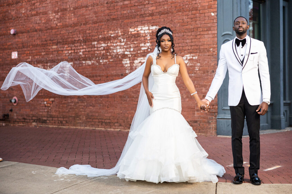 Amp & Asia's stunning black and white wedding at the 701 Whaley in Columbia, South Carolina, exudes classic elegance.