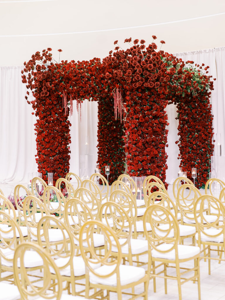 Featured in MunaLuchi Bride Magazine, Issue 28, red and pink florals bloom in this timeless wedding at the Atlanta History Center.