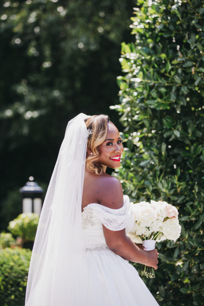 Abigail and Ramon's regal fairytale wedding featured all-white florals, refined decor, and an exquisite venue!