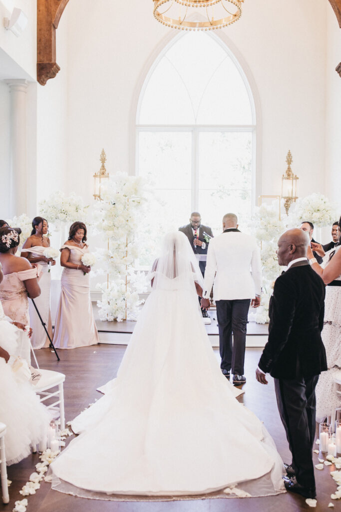 Abigail and Ramon's regal fairytale wedding featured all-white florals, refined decor, and an exquisite venue!