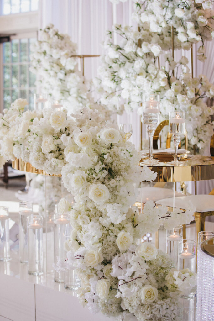 Abigail and Ramon's regal fairytale wedding featured all-white florals, refined decor, and an exquisite venue!