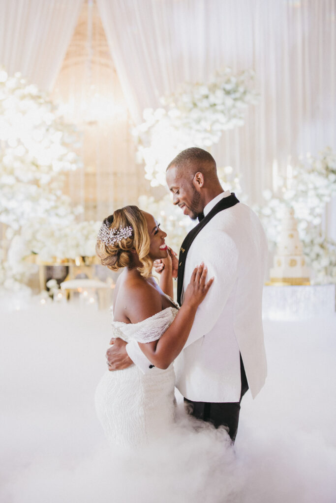 Abigail and Ramon's regal fairytale wedding featured all-white florals, refined decor, and an exquisite venue!