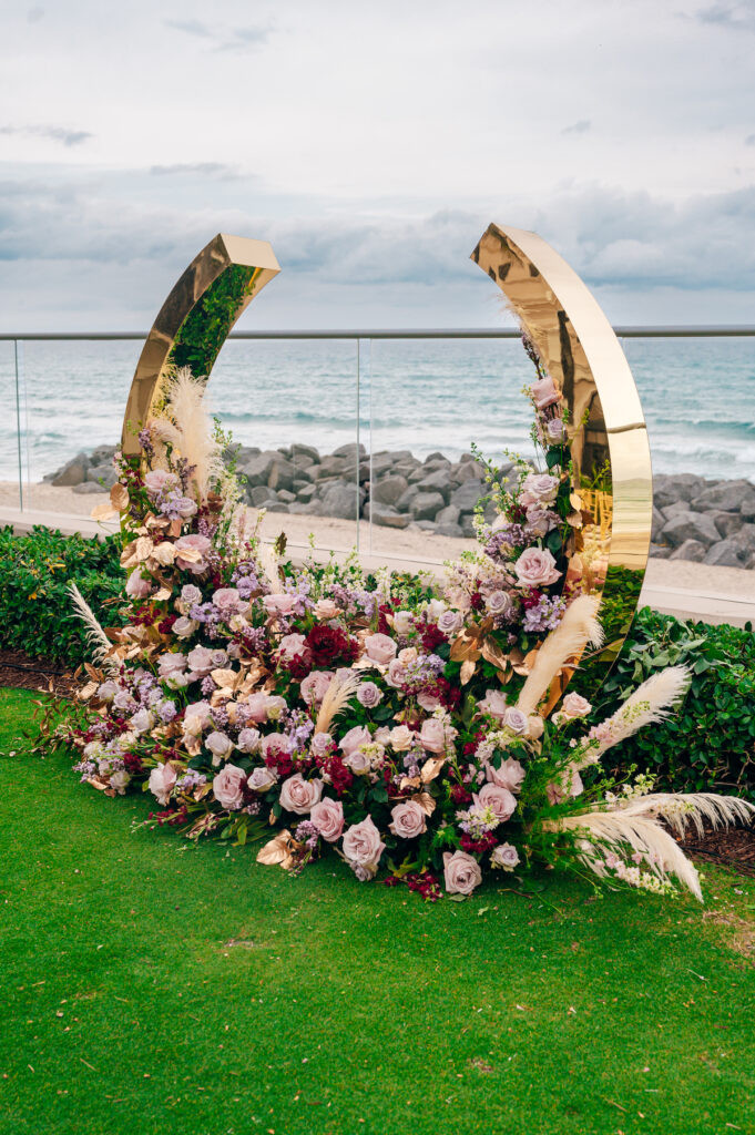 Featured in MunaLuchi Bride, Issue 28, Crystal & Joshua Foster said I-do in a glamorous royal-inspired wedding week at The Breakers.