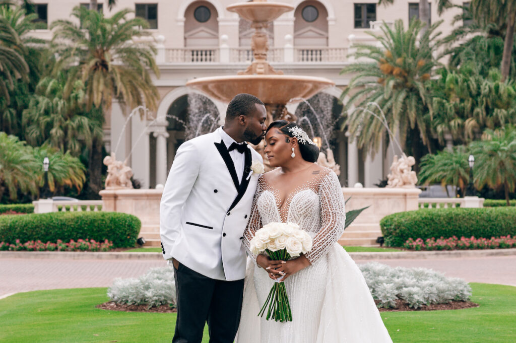 Featured in MunaLuchi Bride, Issue 28, Crystal & Joshua Foster said I-do in a glamorous royal-inspired wedding week at The Breakers.