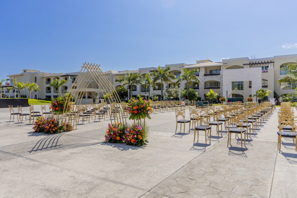 The Grand at Moon Palace in Cancun, Mexico, hosts couples' traditional Nigerian & White Weddings with Benin attire and Ankara patterns.