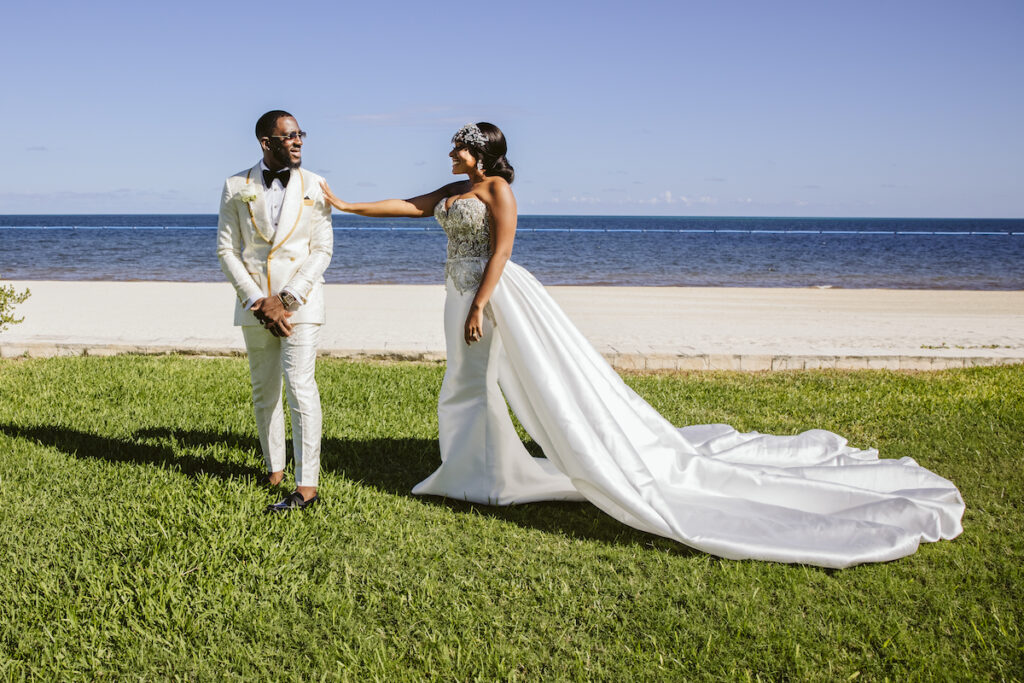 The Grand at Moon Palace in Cancun, Mexico, hosts couples' traditional Nigerian & White Weddings with Benin attire and Ankara patterns.