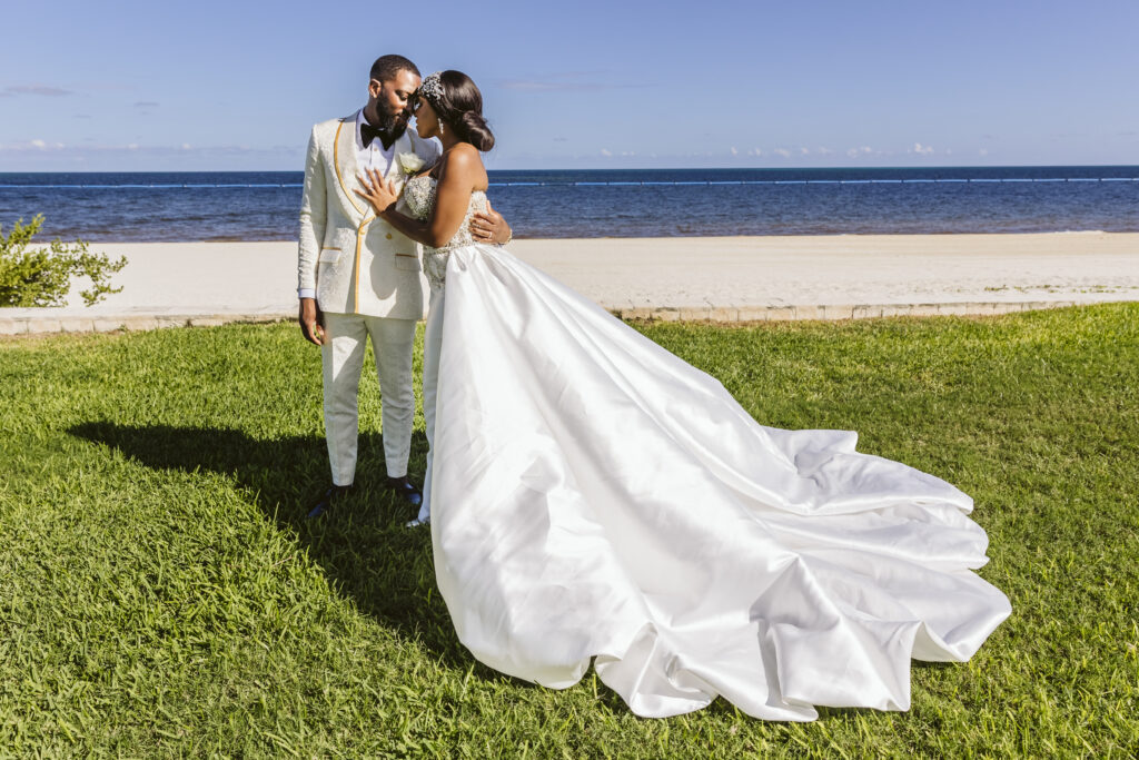 The Grand at Moon Palace in Cancun, Mexico, hosts couples' traditional Nigerian & White Weddings with Benin attire and Ankara patterns.