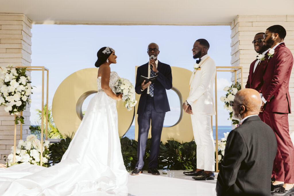 The Grand at Moon Palace in Cancun, Mexico, hosts couples' traditional Nigerian & White Weddings with Benin attire and Ankara patterns.