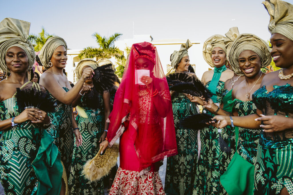 The Grand at Moon Palace in Cancun, Mexico, hosts couples' traditional Nigerian & White Weddings with Benin attire and Ankara patterns.