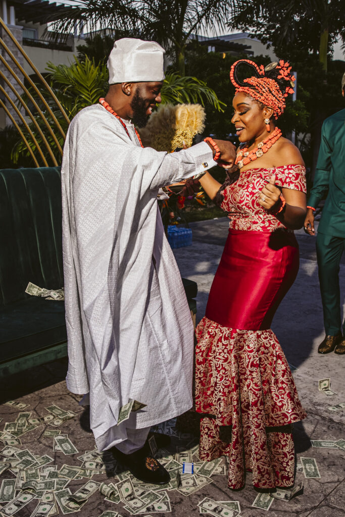 The Grand at Moon Palace in Cancun, Mexico, hosts couples' traditional Nigerian & White Weddings with Benin attire and Ankara patterns.