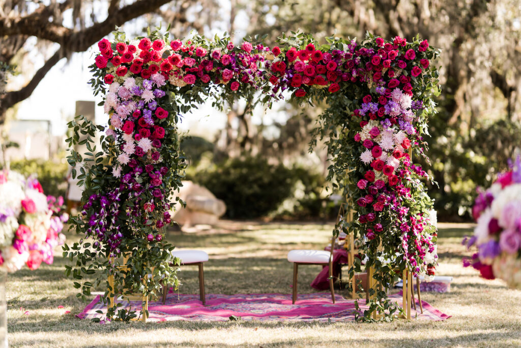 Indian nuptials features fuchsia florals, a sangeet pre-wedding party, and a stunning Hindu wedding ceremony at the New Orleans Museum of Art. 